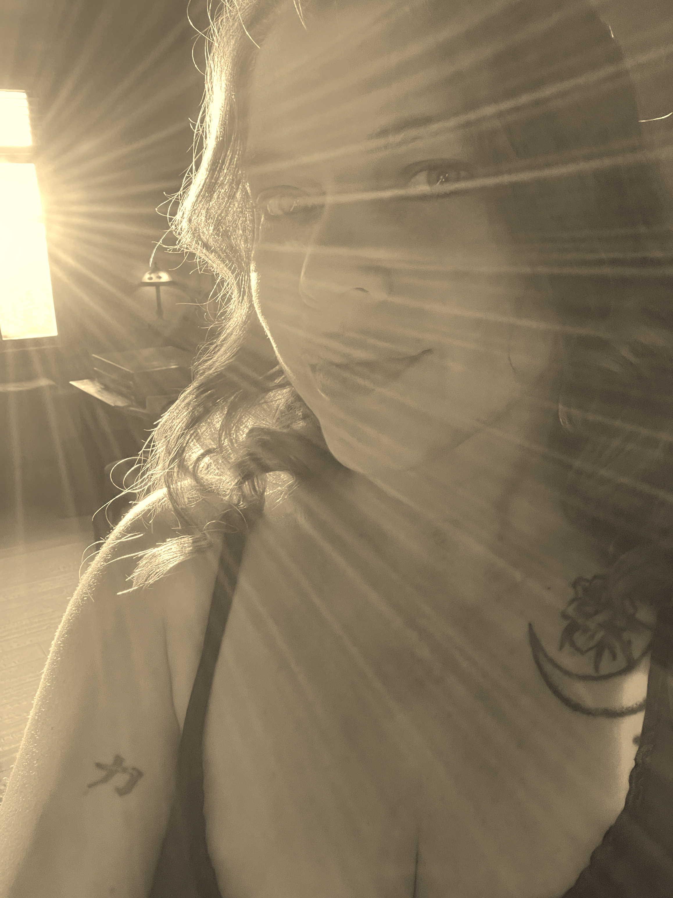 Portrait of Amy Elaine with sunlight rays